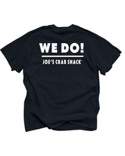 The image shows a black, short-sleeved t-shirt laid flat, displaying the back side. Printed in bold white letters across the upper back of the shirt is the phrase “WE DO!” Below this, in smaller white font, reads “JOE’S CRAB SHACK.” 
