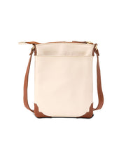 Back view. Cream-colored crossbody bag with a brown bottom corner and strap. The bag features a gold zipper , front pocket and a distinctive gold embellishments.