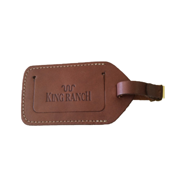 Brown leather luggage tag with King Ranch branding.