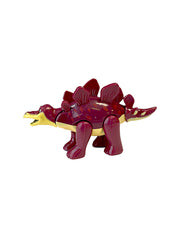 Side view of Cosmo the Stegosaurus figurine.